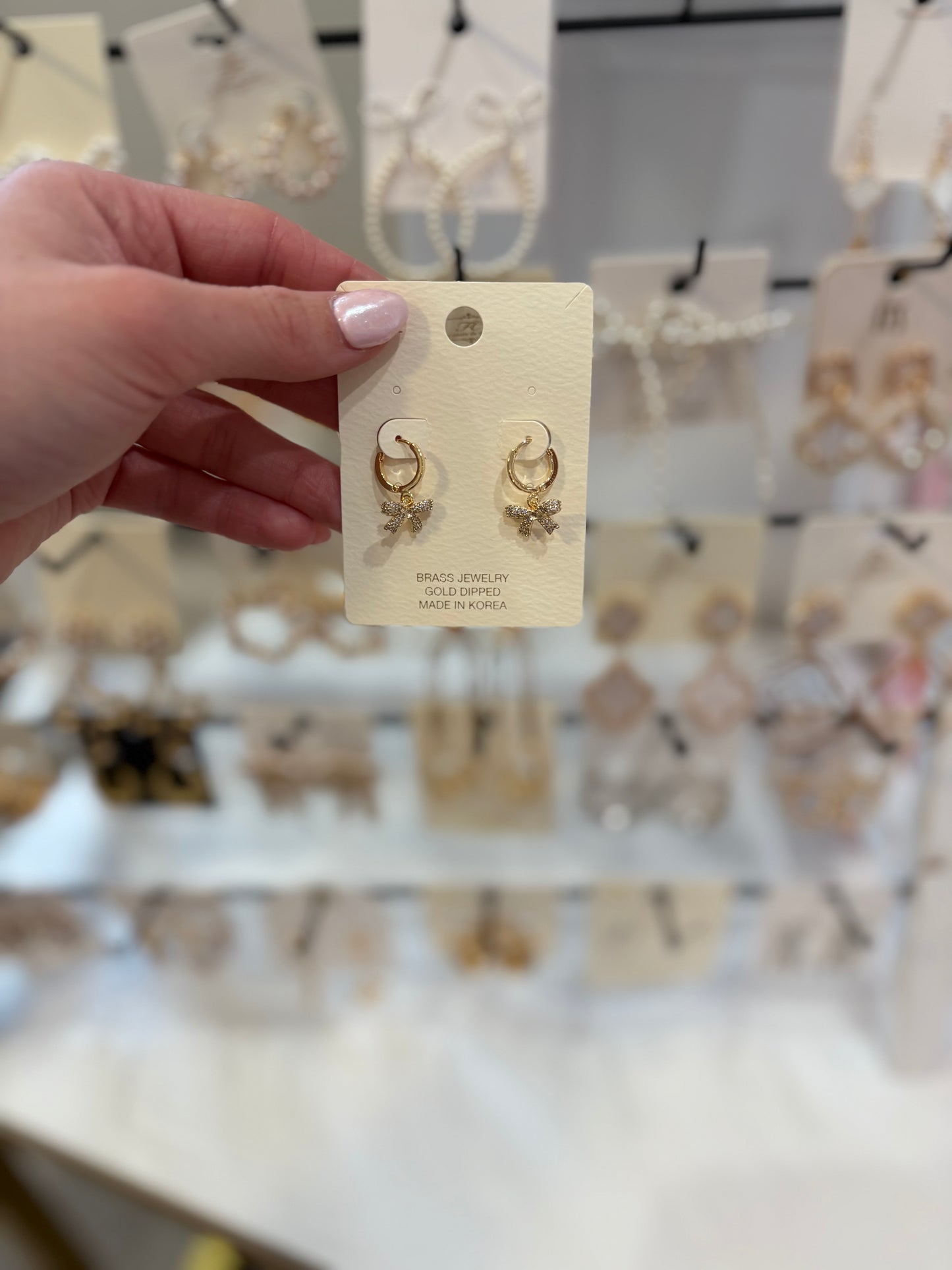 Gold hoops w/ bow dangle earrings